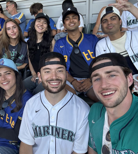 Bolto teammates enjoying a baseball game together.
